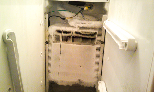 Failed Defroster Inside of Frozen Over Frigidaire Refrigerator Repair