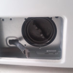 Bottom Panel removed from LG washer to access circulation pump.